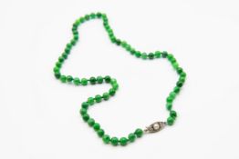 A JADEITE BEAD NECKLACE