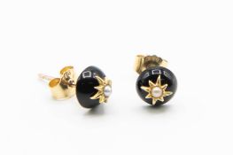 A PAIR OF BLACK ONYX STUD EARRINGS