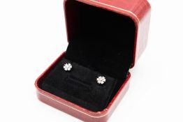 A PAIR OF DIAMOND STUD EARRINGS