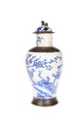 A CHINESE CRACKLE GLAZED BLUE AND WHITE VASE AND COVER