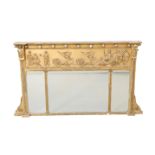 A REGENCY GILT-COMPOSITION TRIPTYCH OVERMANTEL MIRROR