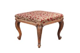 A VICTORIAN WALNUT AND UPHOLSTERED STOOL