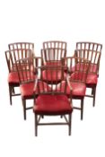 A SET OF NINE GEORGE III MAHOGANY DINING CHAIRS