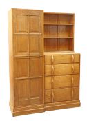 A COTSWOLD SCHOOL OAK COMBINATION WARDROBE