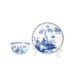 AN EARLY LOWESTOFT BLUE AND WHITE TEA BOWL AND SAUCER, c.1765