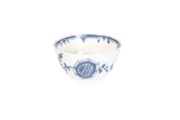 A LOWESTOFT TEA BOWL WITH BLUE FLORAL PRINTS