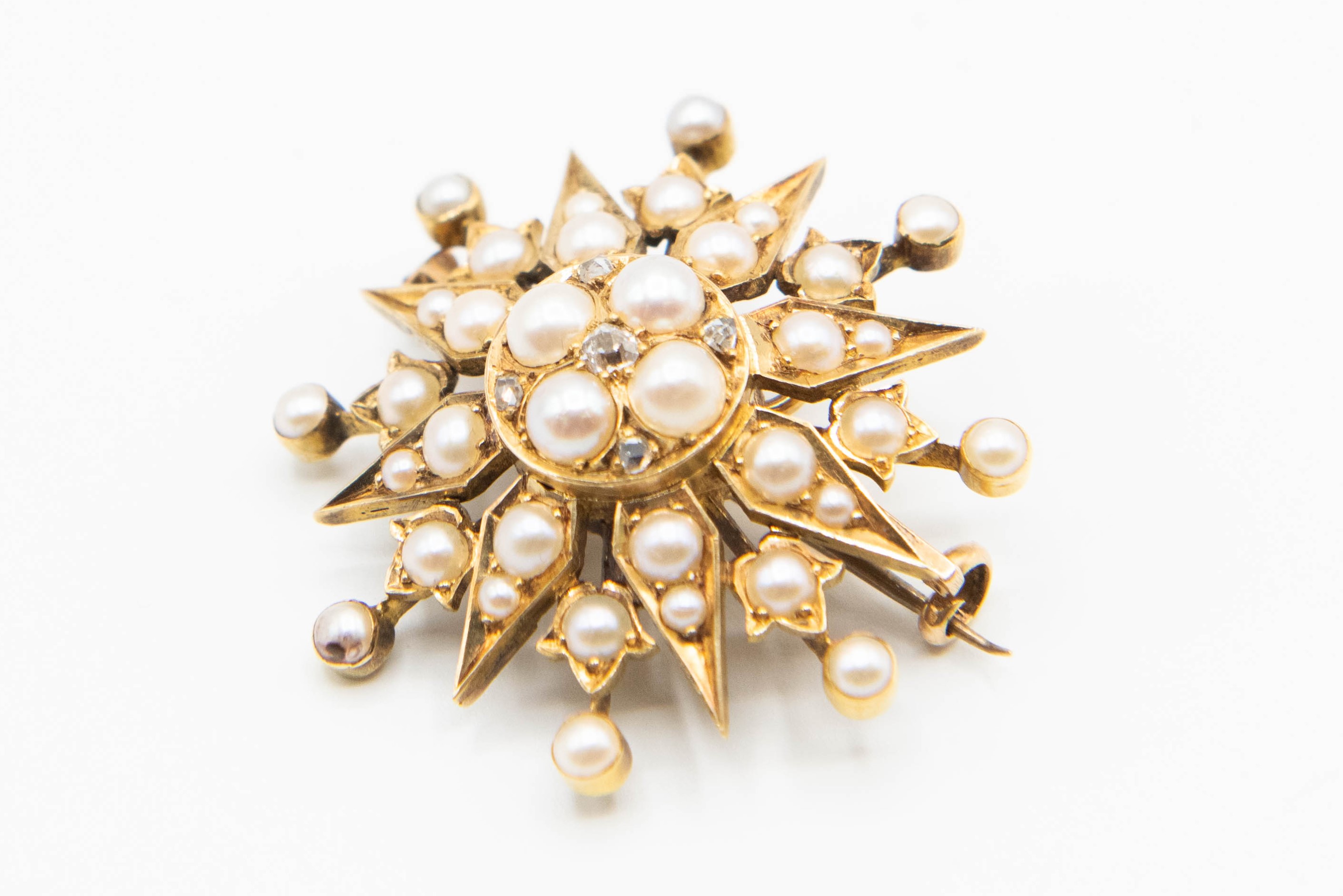 A MID VICTORIAN PEARL AND DIAMOND SET BROOCH