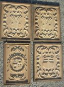 A SET OF FOUR OAK PANELS CARVED WITH A COAT OF ARMS