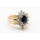 A 10CT YELLOW GOLD, SAPPHIRE AND DIAMOND RING