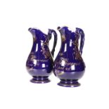 A PAIR OF STAFFORDSHIRE COBALT GROUND JUGS, DATED 1812 AND 1814