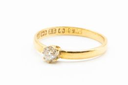 A 22CT YELLOW GOLD AND DIAMOND SET RING