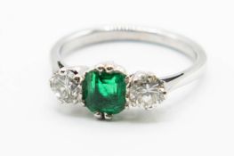 AN EMERALD AND DIAMOND RING