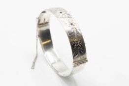 A SILVER BANGLE WITH GEORG JENSEN LTD SPONSORS MARKS