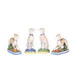 TWO PAIRS OF CONTINENTAL BISQUE PORCELAIN MODELS OF GREYHOUNDS