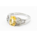 AN 18CT WHITE GOLD YELLOW SAPPHIRE AND DIAMOND RING