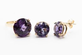 A PAIR OF SYNTHETIC COLOUR CHANGE CORUNDUM EARRINGS AND MATCHING RING