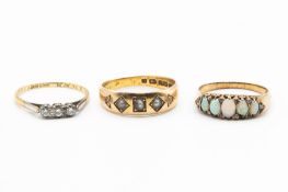 THREE GOLD GEM SET RINGS