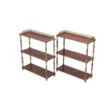 A PAIR OF REGENCY MAHOGANY AND BRASS THREE-TIER HANGING SHELVES