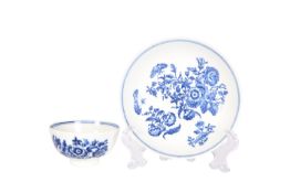 A LOWESTOFT BLUE AND WHITE TEA BOWL AND SAUCER