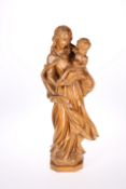 A CARVED BEECH FIGURE OF MADONNA AND CHILD, c.1930
