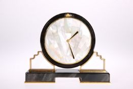 A CARTIER ONYX AND MOTHER-OF-PEARL SUNBURST DESK CLOCK