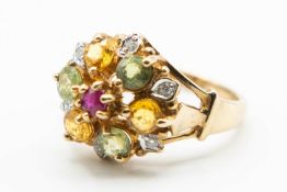 A 9CT YELLOW GOLD AND GEM SET RING