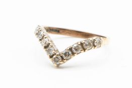 A 9CT YELLOW GOLD AND DIAMOND RING