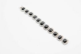 A CONTEMPORARY 18CT WHITE GOLD ITALIAN BLACK DIAMOND AND DIAMOND BRACELET