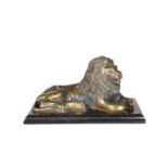A GILDED BRONZE MODEL OF A RECUMBENT LION