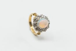 AN OPAL AND DIAMOND CLUSTER RING