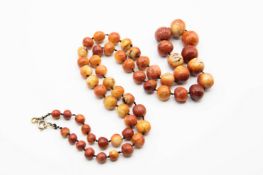 A STAINED IVORY BEAD NECKLACE