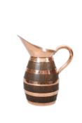 A LATE VICTORIAN COPPER-BOUND COOPERED OAK JUG