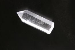 A CARVED ROCK CRYSTAL OBELISK.