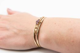 A 9CT YELLOW GOLD BANGLE AND AMETHYST TORQUE BANGLE