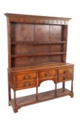 A GEORGE III OAK POTBOARD DRESSER AND RACK,