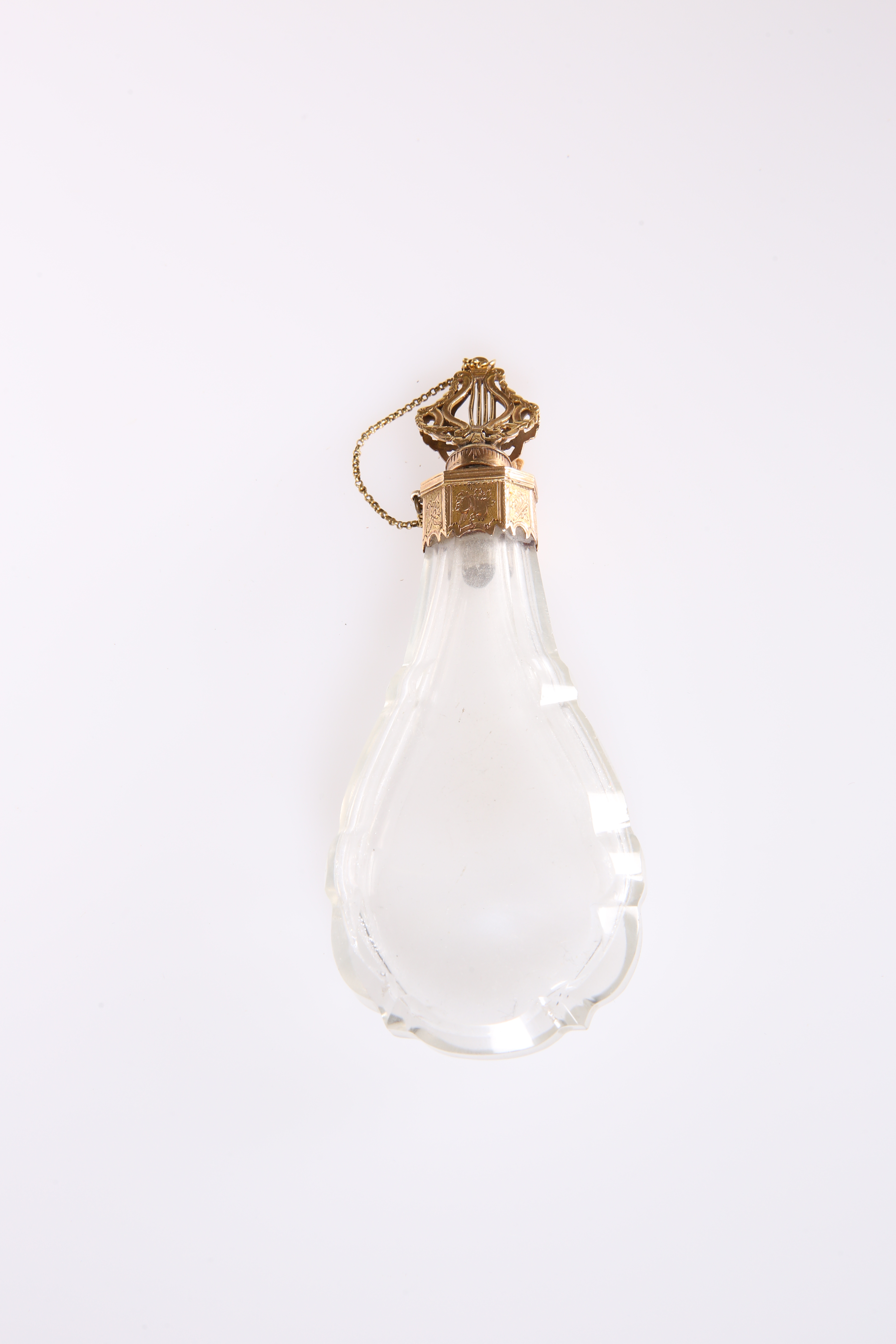 A FRENCH 18 CARAT GOLD-MOUNTED ROCK CRYSTAL SCENT BOTTLE