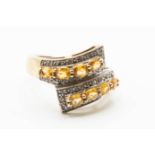 A 9CT YELLOW GOLD AND CITRINE RING