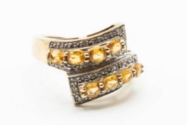 A 9CT YELLOW GOLD AND CITRINE RING