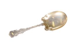 AN AMERICAN STERLING SILVER AND SILVER-GILT SERVING SPOON, c. 1900
