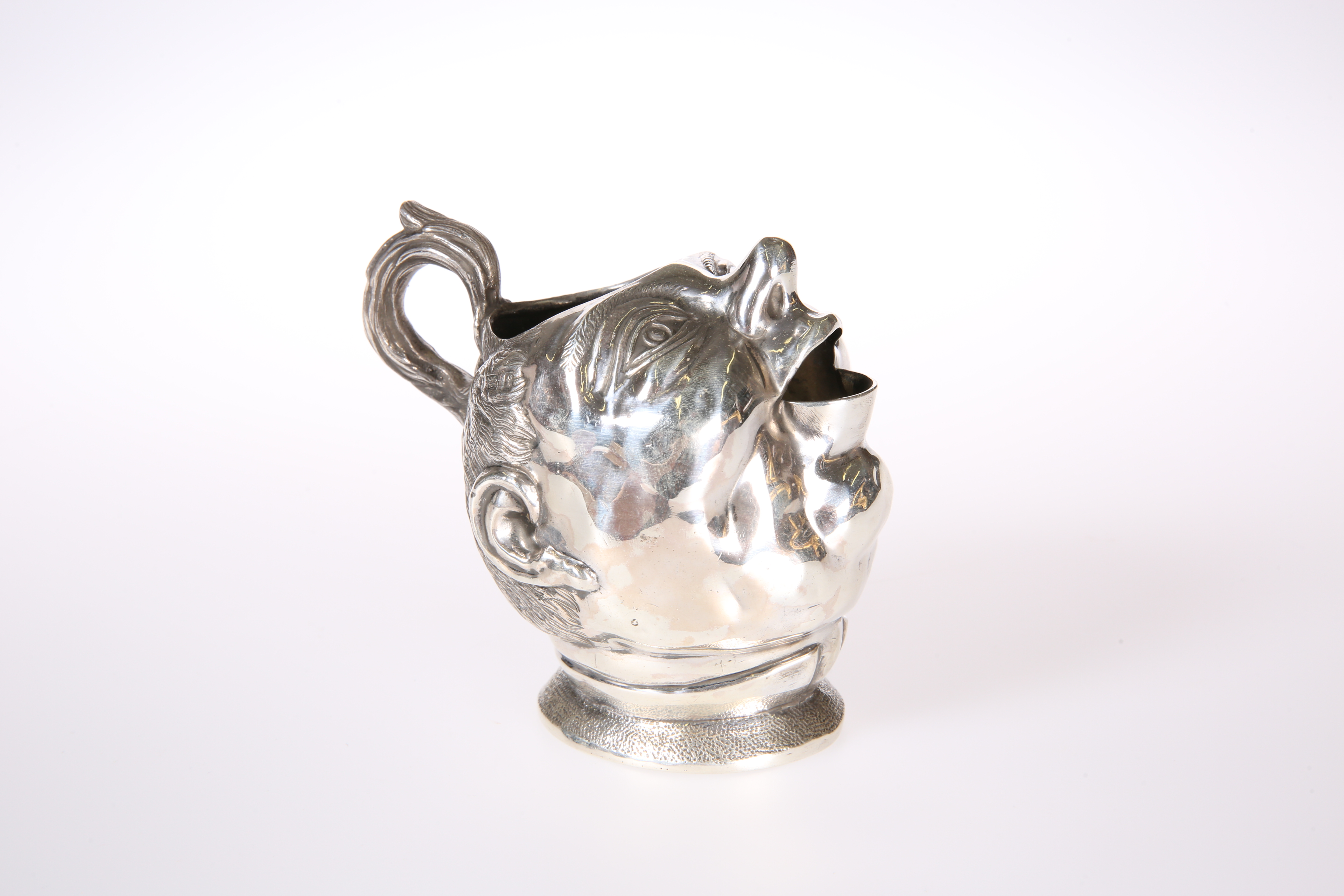 A RARE EDWARDIAN SILVER CHARACTER CREAM JUG