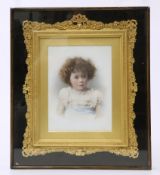 AN EDWARDIAN COLOURED PHOTOGRAPHIC PORTRAIT OF A CHILD