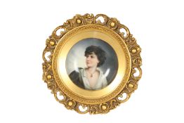 A CONTINENTAL PAINTED PORCELAIN PORTRAIT PLAQUE