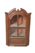 A CONTINENTAL HANGING CORNER CABINET