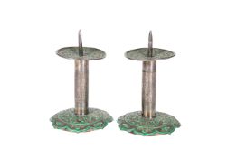 A PAIR OF PERSIAN GREEN ENAMEL AND WHITE METAL PRICKET STICKS