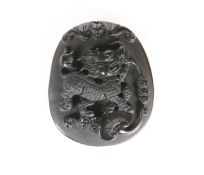 A CHINESE CARVED BLACK ONYX PENDANT