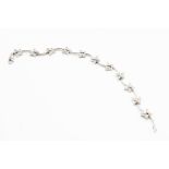 AN 18CT WHITE GOLD AND DIAMOND SET BRACELET