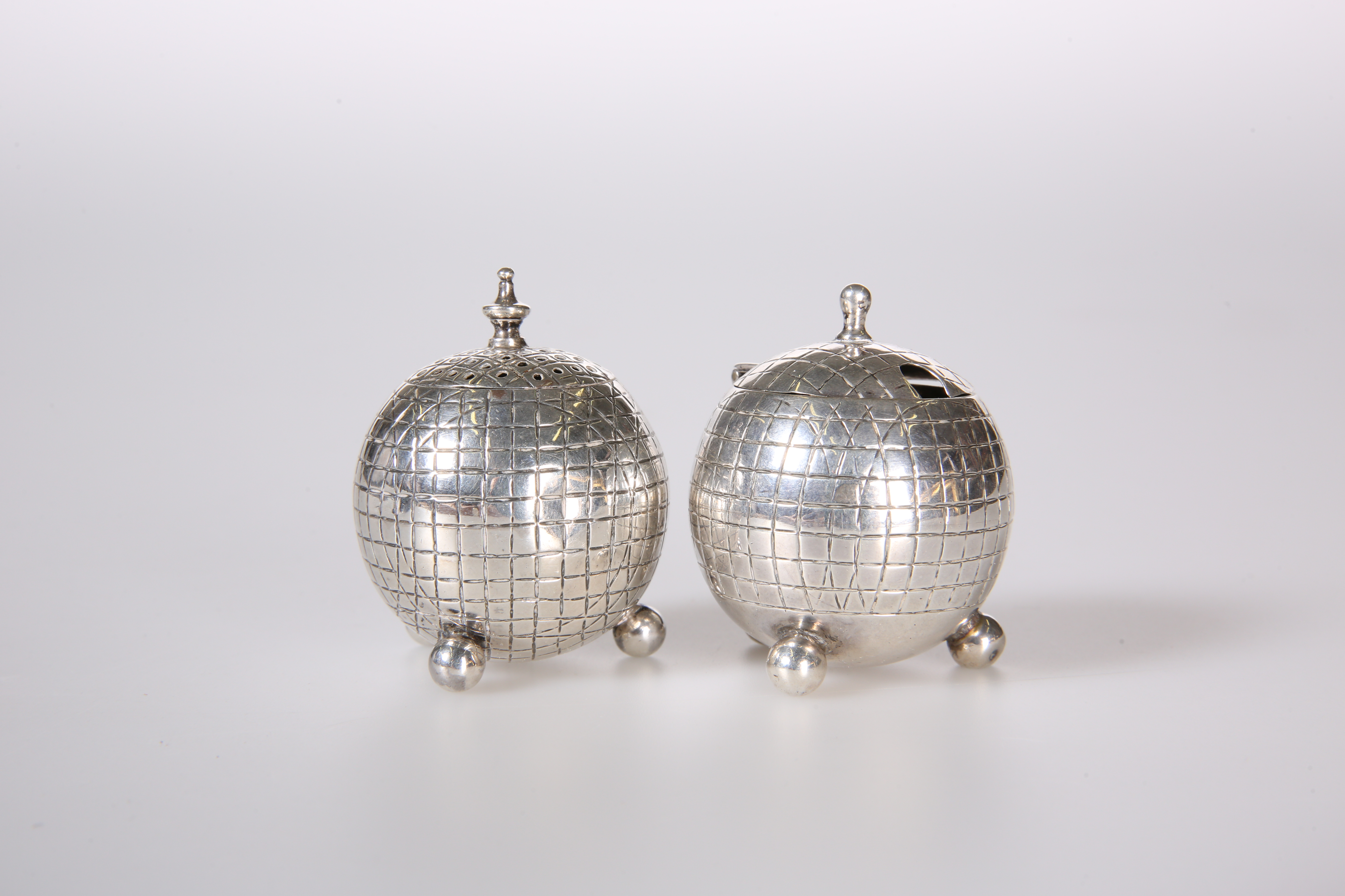 TWO SILVER "GOLF BALL" CRUETS