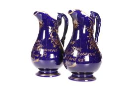A PAIR OF STAFFORDSHIRE COBALT GROUND JUGS, DATED 1812 AND 1814