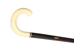 AN EARLY 20TH CENTURY IVORY-HANDLED LIGNUM VITAE WALKING STICK