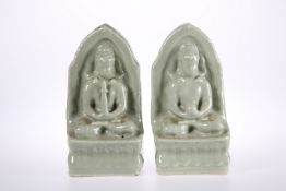 A PAIR OF CHINESE CELADON BUDDHAS